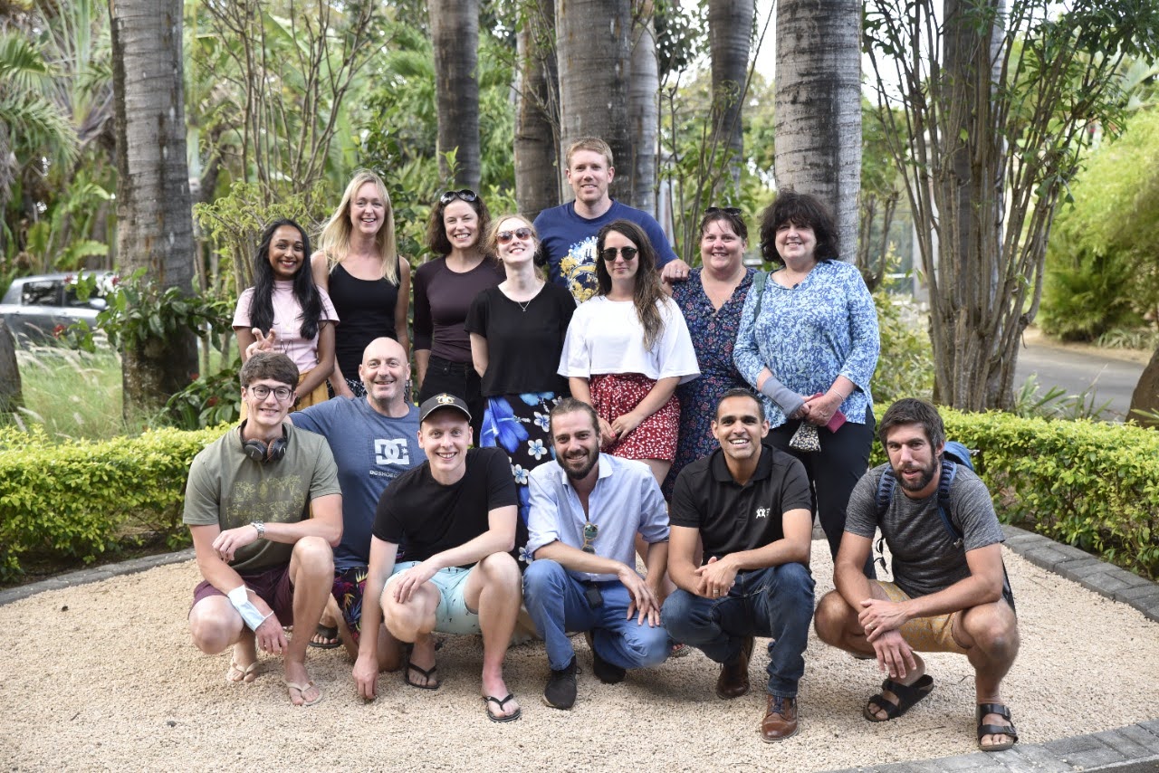 Group of tourists in Mauritius under trees